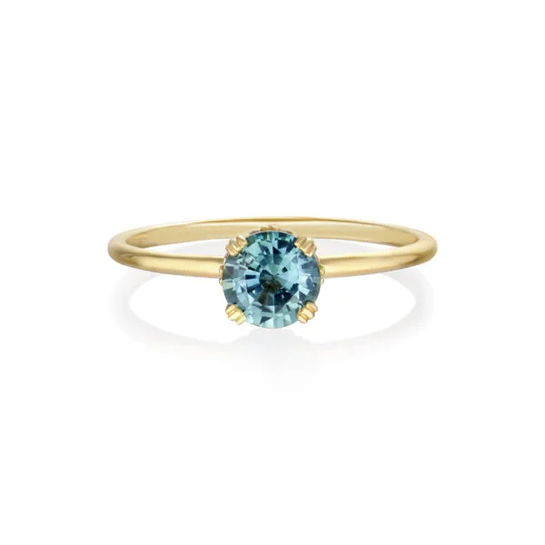 Teal sapphire ring with diamonds set in 18K yellow gold