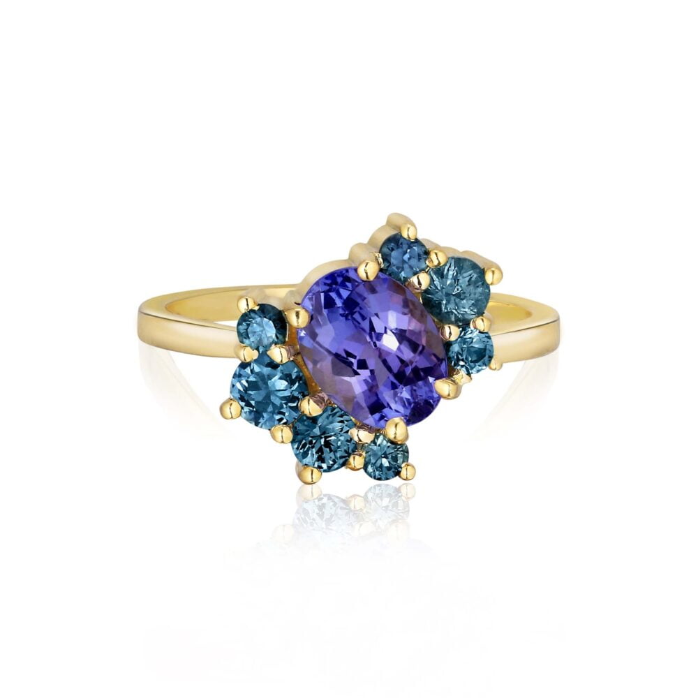 Tanzanite ring with teal sapphires set in 18K yellow gold