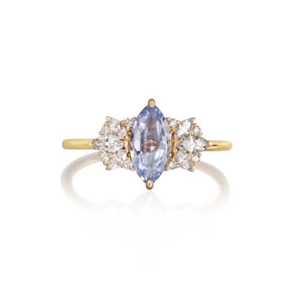Fairy tale ring with blue sapphire and diamonds set in 18K yellow gold