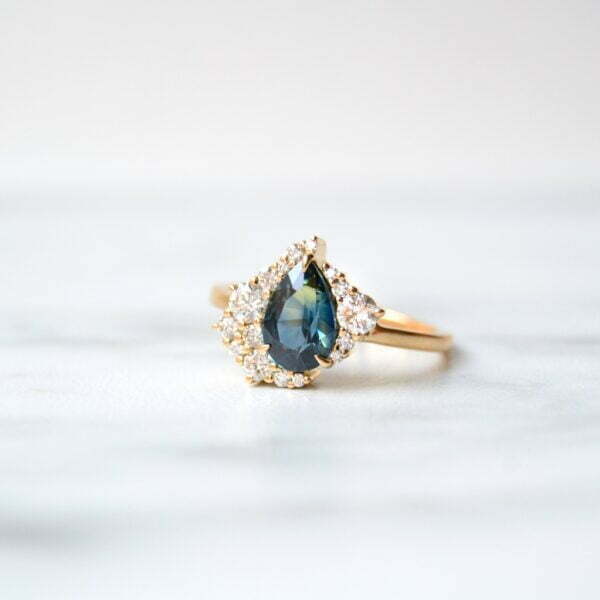 Asymmetric teal sapphire ring