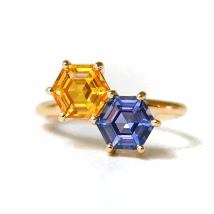 Toi et moi ring with blue and orange sapphires set in 18k yellow gold