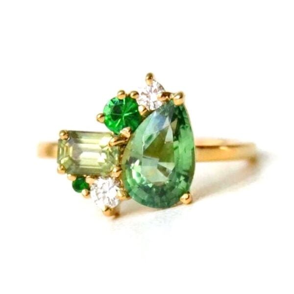Green tourmaline Ring with sapphires set in 18k yellow gold