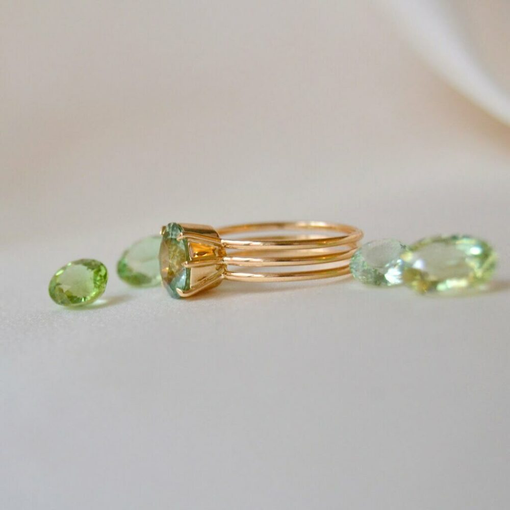 Oval green tourmaline ring in yellow gold