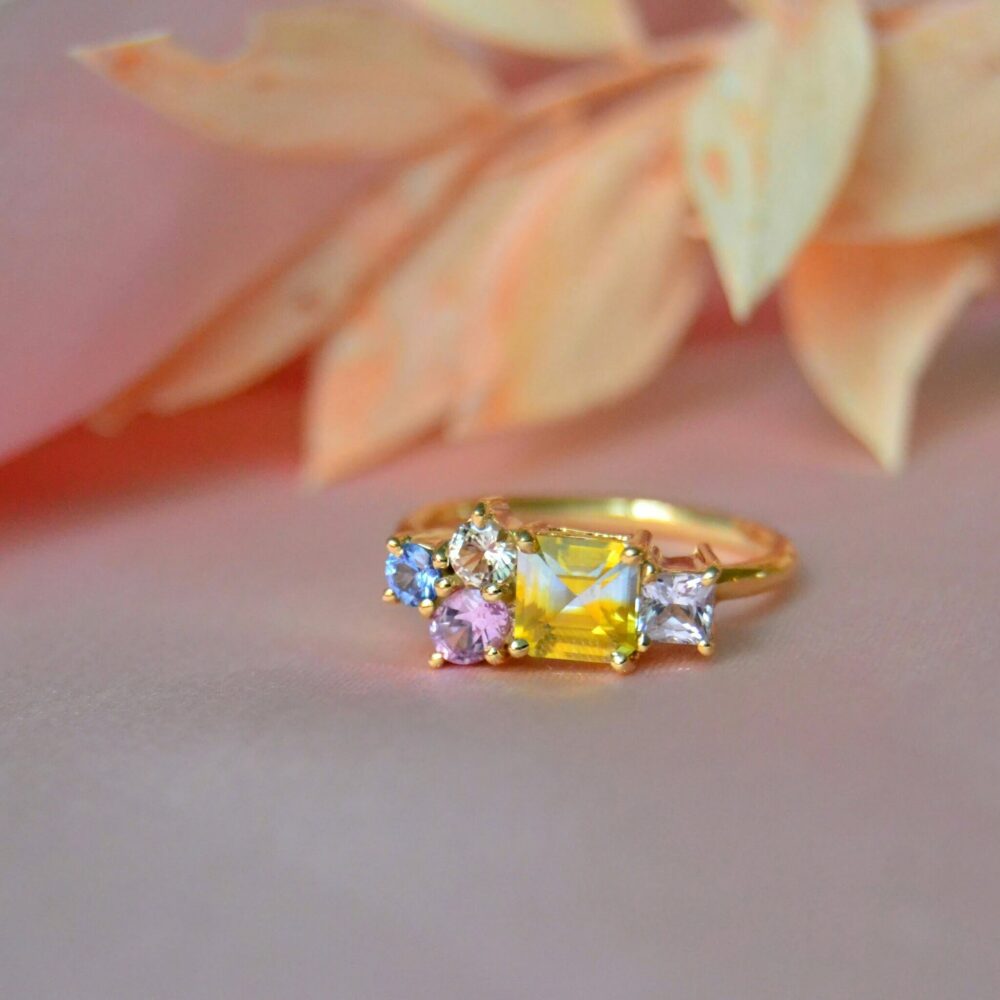 Bi-color sapphire ring set with pastel sapphires