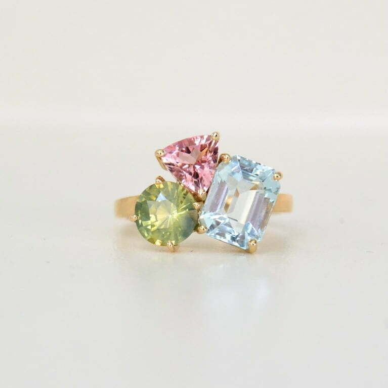 Gemstone cluster ring with birthstones set in yellow gold
