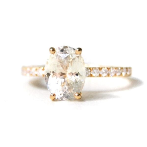 2.30ct oval white sapphire solitaire ring with diamonds set in 18K yellow gold