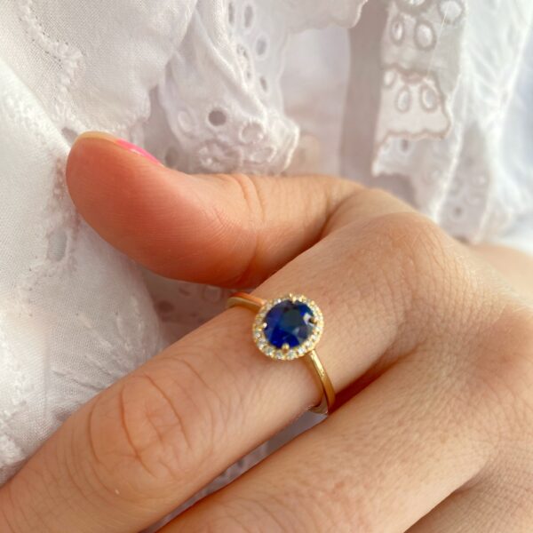 Blue sapphire halo ring with diamonds