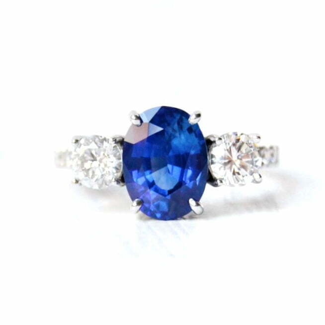 heirloom diamonds set in a three stone ring with 3ct blue sapphire and diamonds