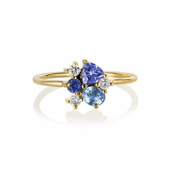 Tanzanite ring with sapphires and diamonds set in 18K yellow gold