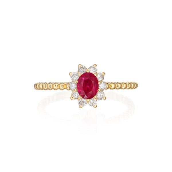 Ruby halo ring with diamonds set in 18K yellow gold