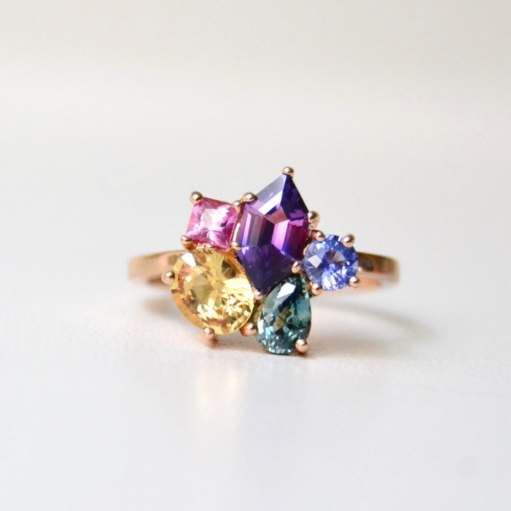 5 stone cluster ring with bi-color, yellow, green, blue and pink sapphires set in 18K rose gold