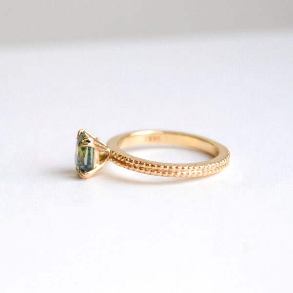 Green sapphire ring with miligrain band