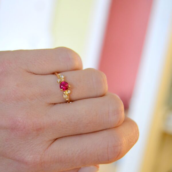 Ruby ring with asymmetric set diamonds