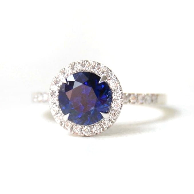 Blue sapphire ring in a halo design with diamonds
