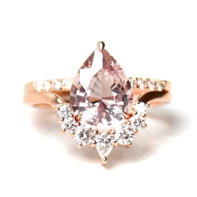 peach sapphire ring with diamonds set in 18k rose gold