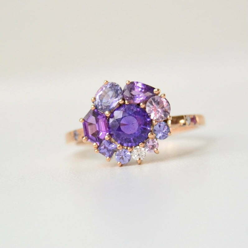 Round purple sapphire halo ring in rose gold