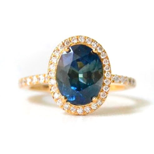 Color changing sapphire halo ring with diamonds