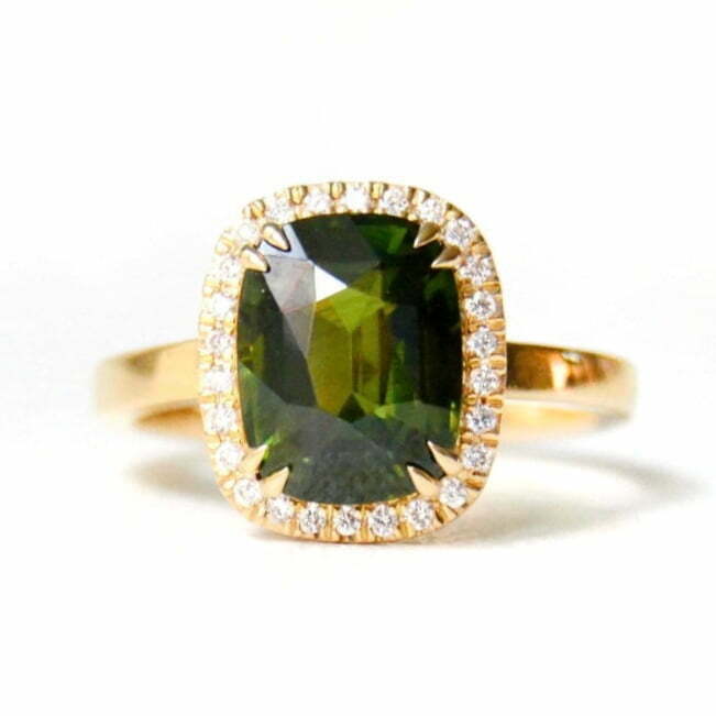 halo ring with green zircon and diamonds