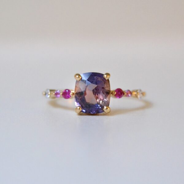 Unheated bi-color sapphire ring with diamonds set in 18K yellow gold