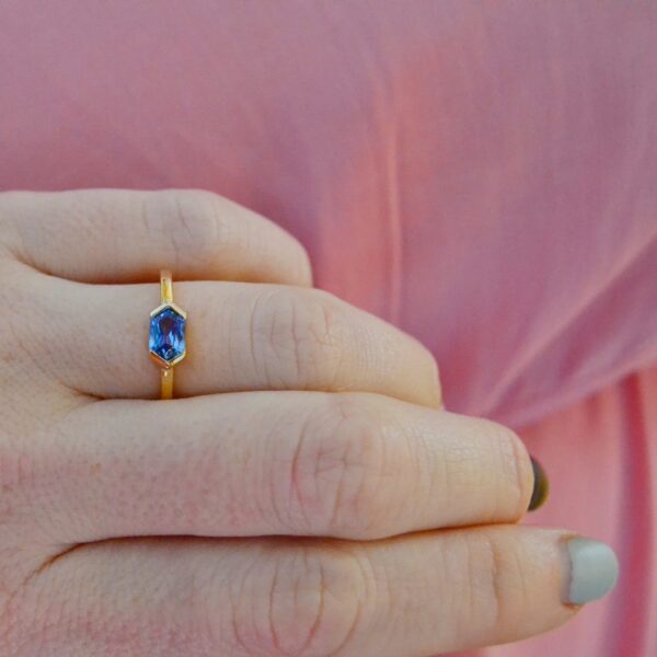 Blue sapphire east west ring