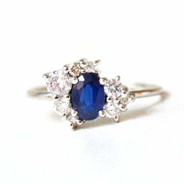 asymmetric ring With blue sapphire and diamonds set in 18K white gold