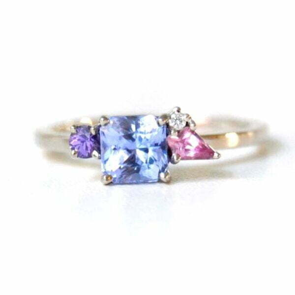 Blue sapphire ring with diamond and sapphires set in 18k white gold