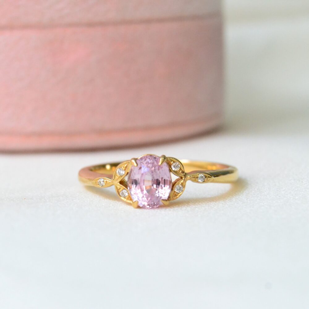 Oval pink sapphire ring with diamonds