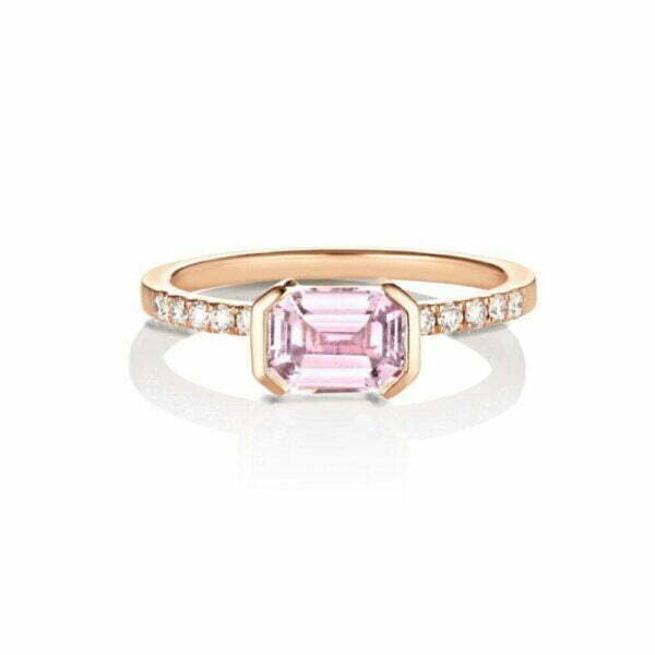Emerald cut sapphire set east west in 18K rose gold with diamonds
