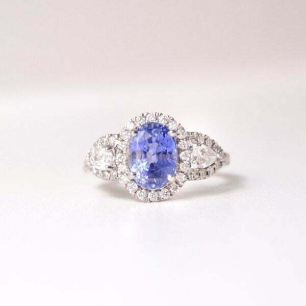 Three stone ring with blue sapphire on 3ct with diamonds set in platinum