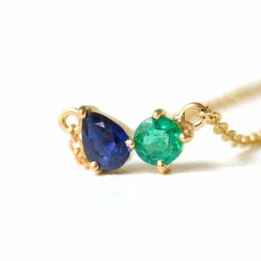 toi et moi necklace with sapphire and emerald set in 18k yellow gold