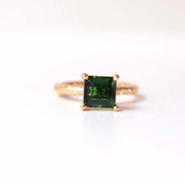 Square green tourmaline ring in a high setting with diamonds