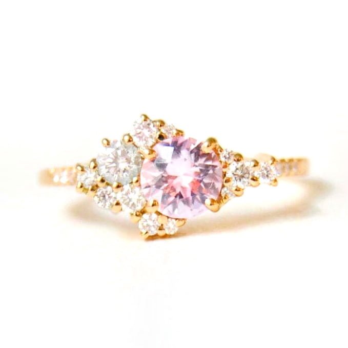 Baby pink sapphire ring with diamonds set in 18k yellow gold