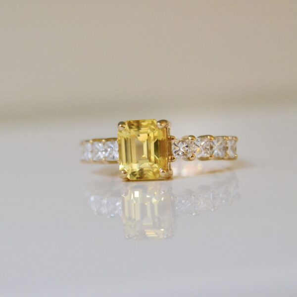 Yellow sapphire ring with diamonds set in 18K yellow gold