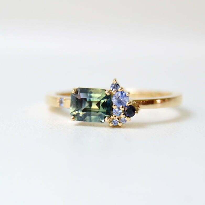 Cluster ring with bi-color sapphire and blue sapphires