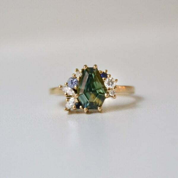 Sapphire cluster ring with diamonds set in 18K yellow gold