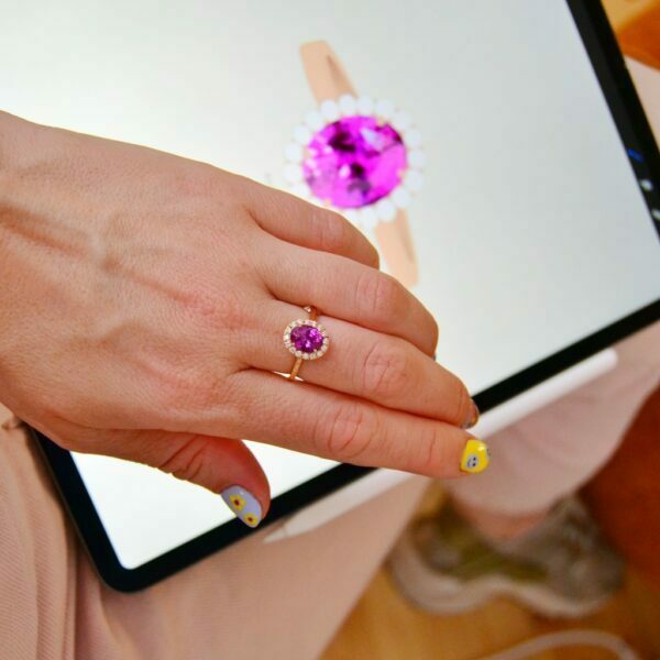 Pink halo ring with sapphire and diamonds
