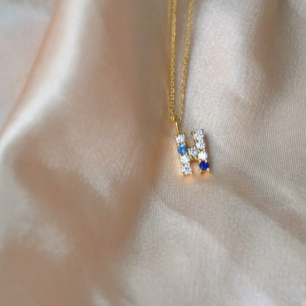Letter necklace with diamonds and sapphires