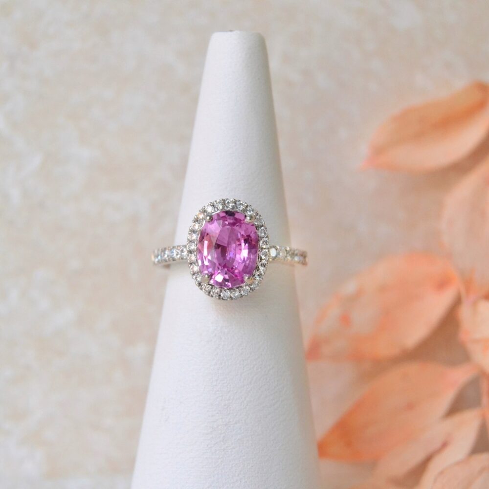 Pink sapphire halo ring in 18K white gold