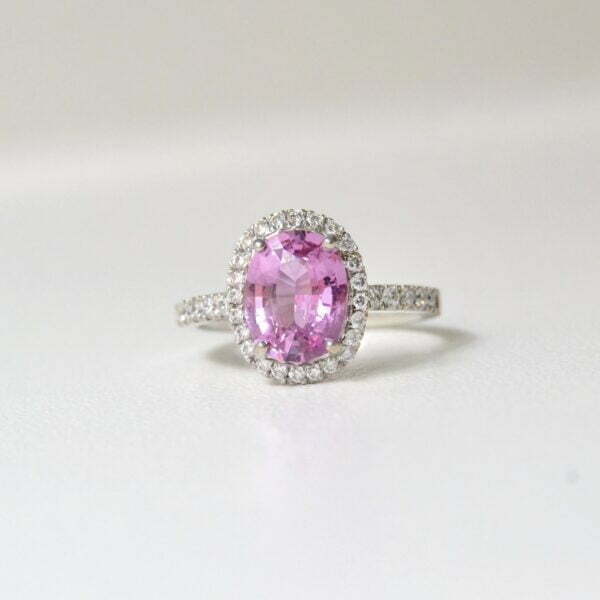 Pink sapphire halo ring in white gold with diamonds