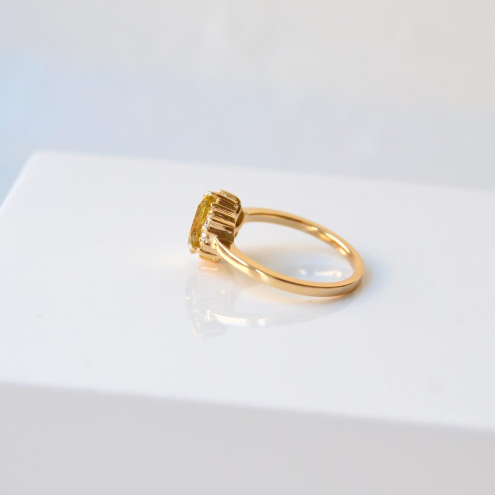 Asymmetric yellow sapphire ring with diamonds