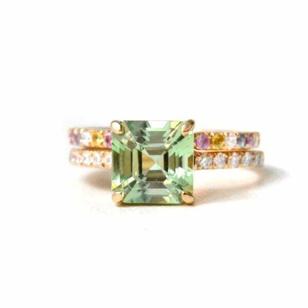 Asscher cut green tourmaline ring stack with diamonds and sapphires set in 18K yellow gold