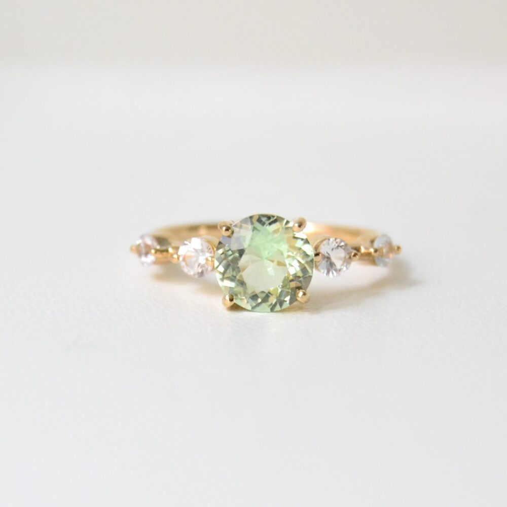 Green tourmaline ring with white sapphires in 18k yellow gold