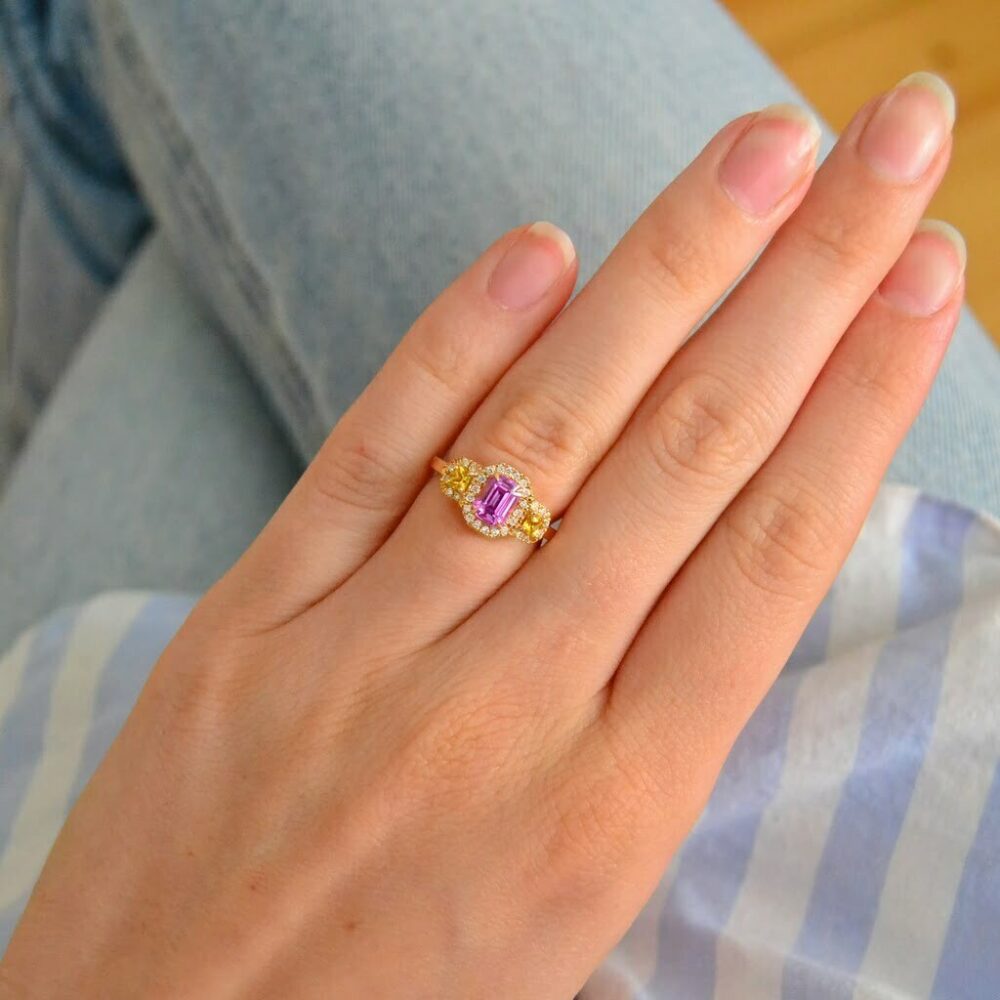 Pink sapphire halo ring with diamonds in 18k yellow gold