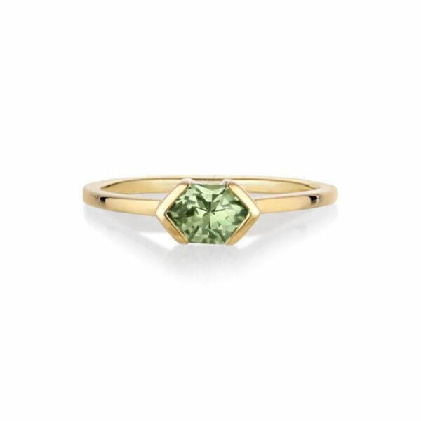 Green sapphire ring in an east west setting of 18K yellow gold