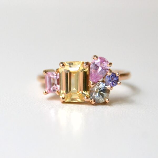 18k rose gold ring with unheated yellow sapphire and pastel sapphires set in 18k rose gold