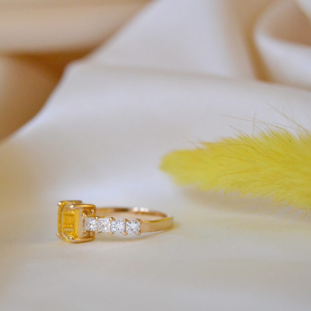 Emerald cut yellow sapphire ring with diamonds