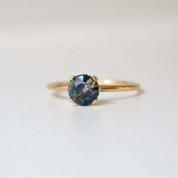 Hidden diamond ring with bi-color sapphire