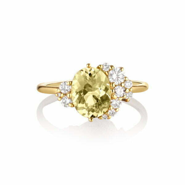 Yellow tourmaline ring with a halo of diamonds set in 18k yellow gold