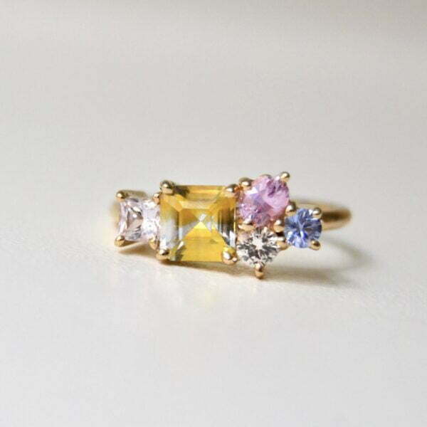 Unheated bi-color sapphire ring set with pastel sapphires in 18K yellow gold