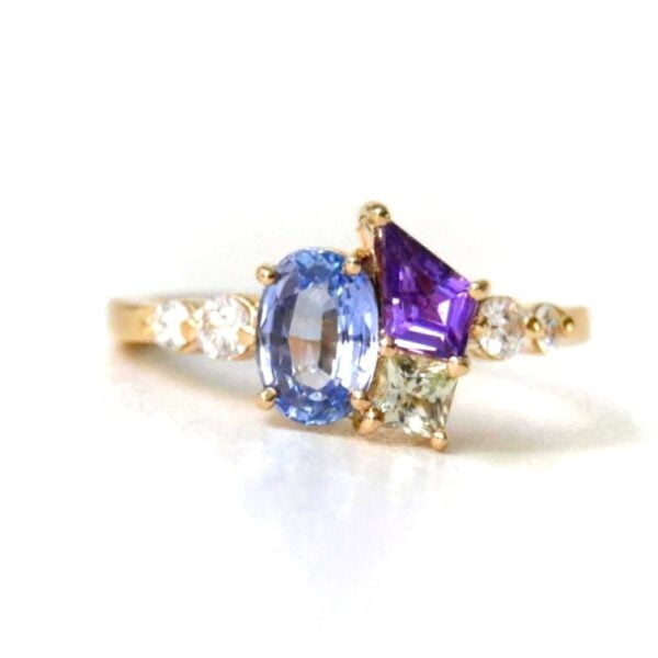 Sapphire cluster ring with diamonds set in 18k yellow gold